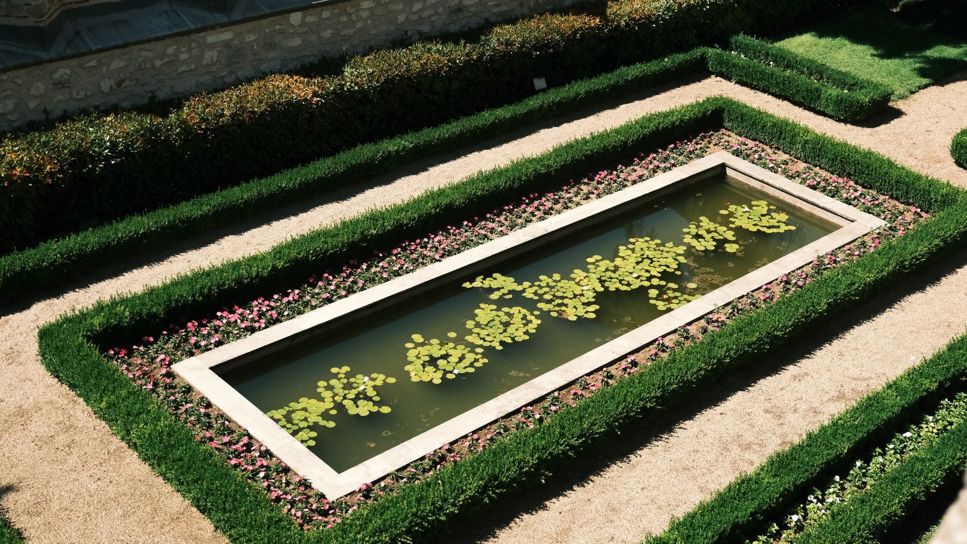 An evening garden lit along a stone path